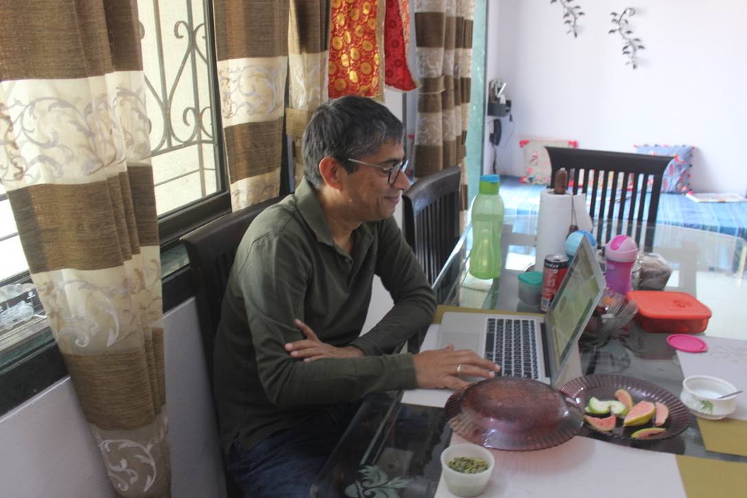 Kunwer Sachdev, founder of Su-Kam and Su-vastika, working at his laptop at home during the Su-Kam bankruptcy years