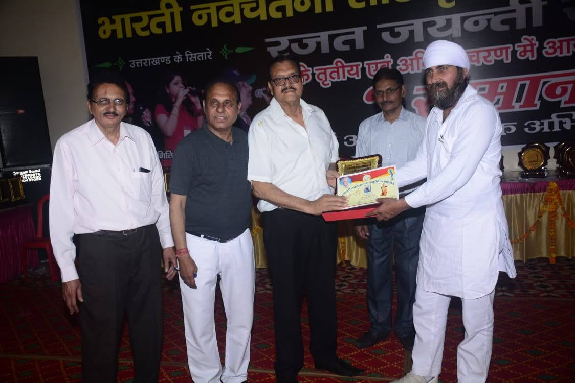 Late Shri Mukesh Mehrotra being felicitated at a public function in Kashipur